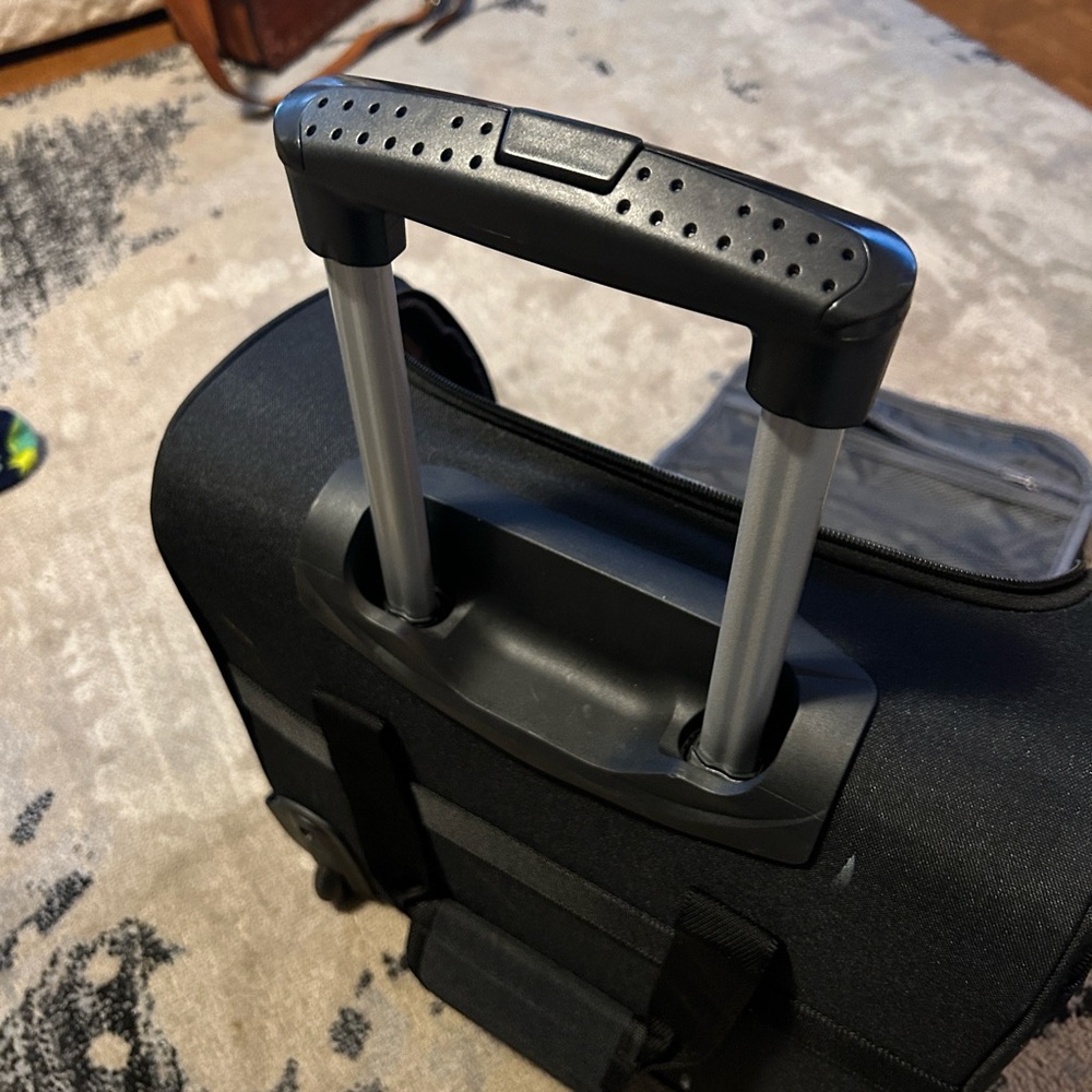 Travel and travel/computer rolling bag. New without tags